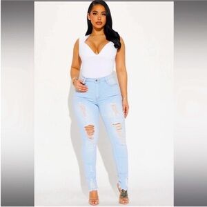 Fashion Nova high waisted distressed jeans
